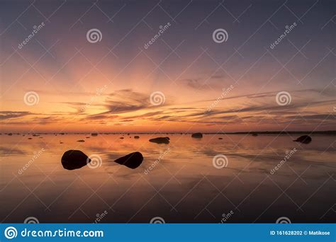 Seacoast Sunset With Intense Sun Rays Afterglow Stock Photo Image Of