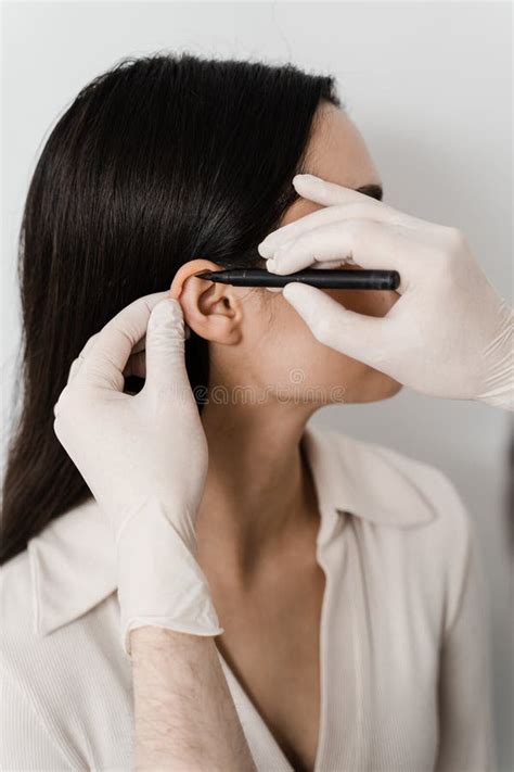 Surgeon Doctor Marking Girl Ear Before Otoplasty Cosmetic Surgery