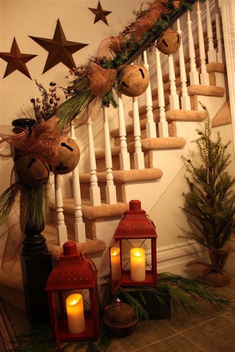 Love the lights hanging at the top inside this christmas lantern. 37 Beautiful Christmas Staircase Décor Ideas To Try - DigsDigs