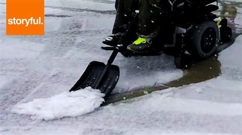 Determined Boy Uses His Wheelchair As Snowplow Youtube
