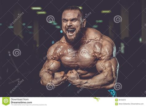 Handsome Fit Caucasian Muscular Man Flexing His Muscles In Gym Stock