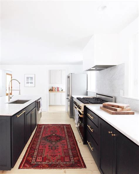 Maybe you would like to learn more about one of these? Those black cabinets!! That deep red, Persian rug ...