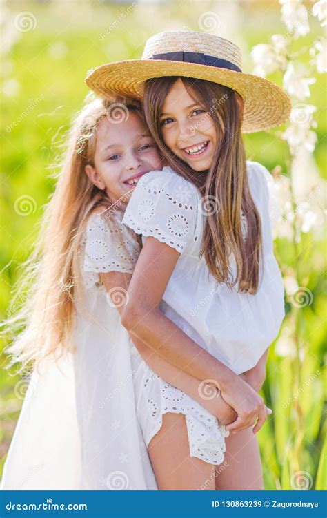 two girls are girlfriends summer in nature writes video to camera in her hands holds bottle