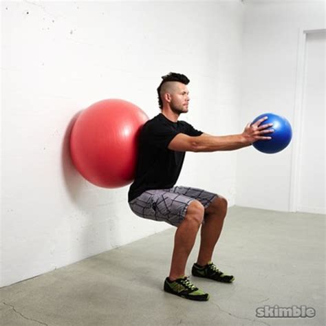 Wall Ball Squats With Ball Raises Exercise How To