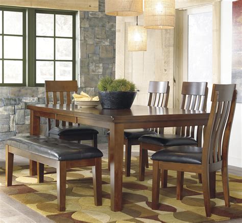 Dining table and six bar stools. Ashley Signature Design Ralene D594-35+4x01+00 Casual 6-Piece Dining Set with Butterfly ...