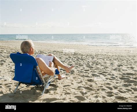 Man Relaxing In Beach Chair Stock Photo Alamy