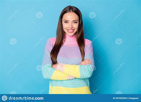 Portrait Of Attractive Cute Long Haired Cheerful Girl Folded Arms Isolated Over Vibrant Blue