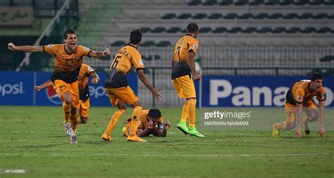 Players From Kuwaits Qadsia Sc Celebrate After Winning The 2014 Afc