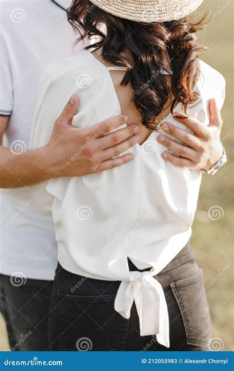 The Guy Hugs The Girl With His Hands Behind The Back Stock Image Image Of Together Secret