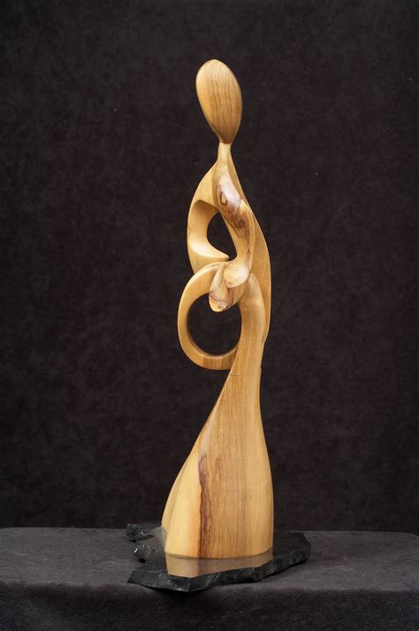 Wood sculptures. Desire to express in art. The Experience of Touch.