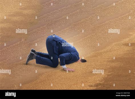 Businessman Hiding His Head In Sand Escaping From Problems Stock Photo