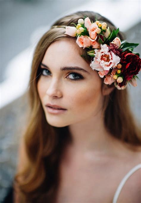 A Woman With Long Hair And Flowers In Her Hair Is Wearing A Flower