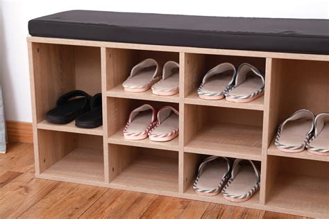 It has a hidden drawer, two shelves for shoes to be placed on, a side basket that can put magazines or books in, and comes with a cushion to sit on. Natural Wooden Shoe Cubicle Storage Entryway Bench with ...