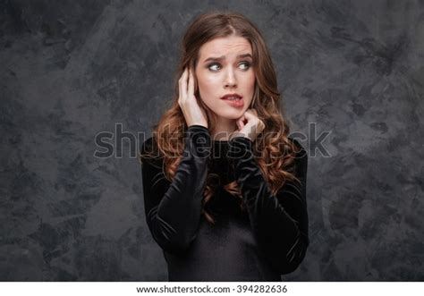 Portrait Scared Confused Young Woman Biting Stock Photo 394282636
