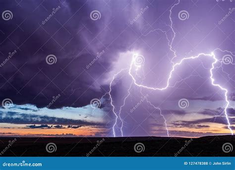 Lightning Strikes From A Storm At Sunset Stock Photo Image Of