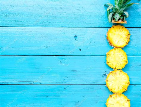 The Summer Pineapple Is Slice For Eat On Blue Wooden Background