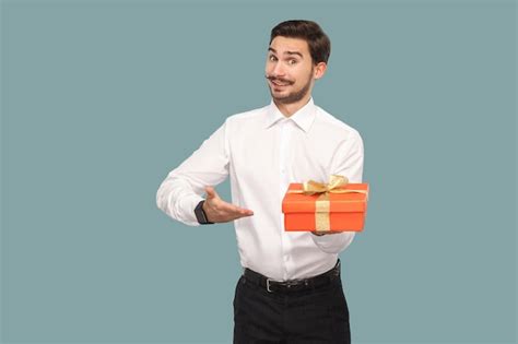 Premium Photo Funny Happy Bearded Man In White Shirt Standing And Holding Red T Box