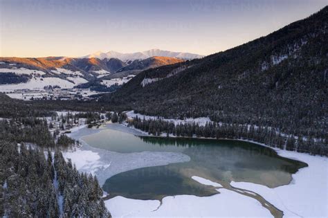 Sunrise Over The Village Of Dobbiaco And Frozen Lake Val Pusteria