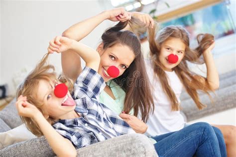 Mother And Kids Being Crazy At Home Stock Photo Image Of Pull