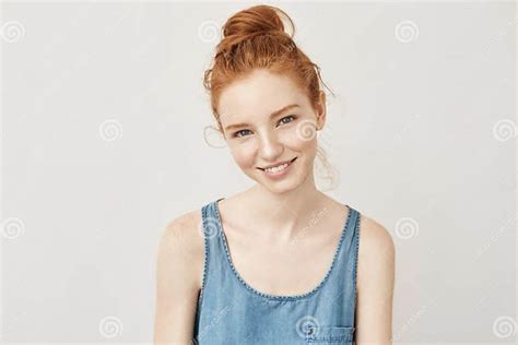 Portrait Of Appy Beautiful Redhead Girl With Freckles Smiling Sincerely