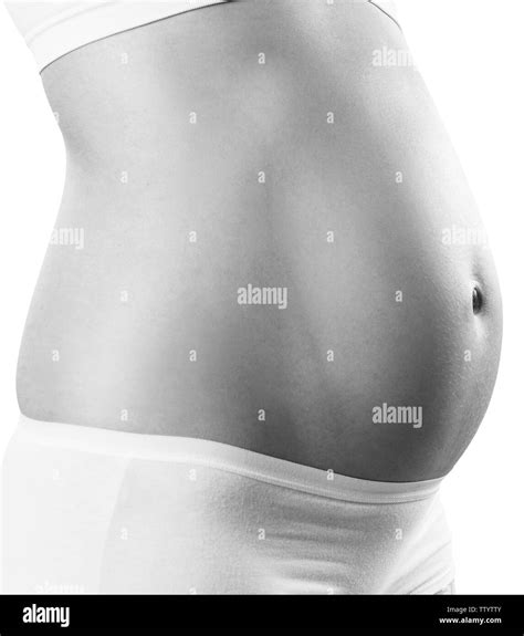 la mujer embarazada con el vientre en las primeras etapas del embarazo fotografía de stock alamy