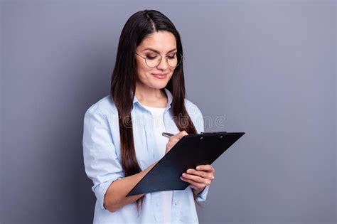 Photo Of Adorable Pretty Mature Woman Wear Formal Shirt Spectacles Writing Clipboard Isolated
