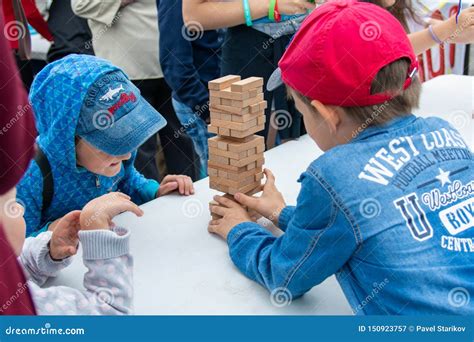 Children Play Jenga Outdoors Editorial Photography Image Of Light