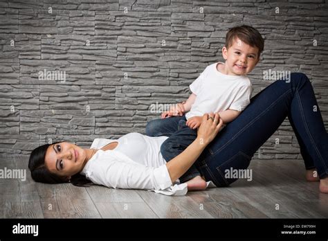 Mother And Son Cuddling On The Floor Stock Photo Alamy