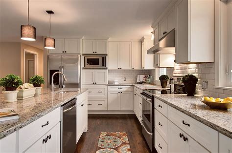 Shaker style furniture usually incorporates cabinets with recessed panel doors, light finishes and simple hardware. White Shaker Cabinets - Kitchen Photos