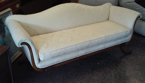 The sofa features carved curvilinear arms, three loose seat cushions, and curved reeded legs ending in brass caps int eh shape of animal paws. UHURU FURNITURE & COLLECTIBLES: SOLD Vintage Reupholstered ...