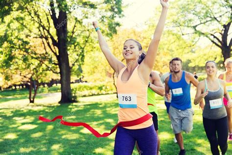 Happy Young Female Runner Winning On Race Finish Stock Photo By ©syda