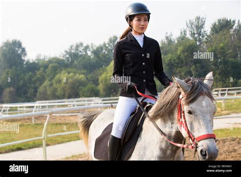 Chinese Young Woman Riding Horse Hi Res Stock Photography And Images