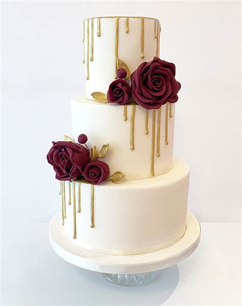 Gold And Ivory Drippy Wedding Cake With Burgandy Roses The Cakery Leamington Spa