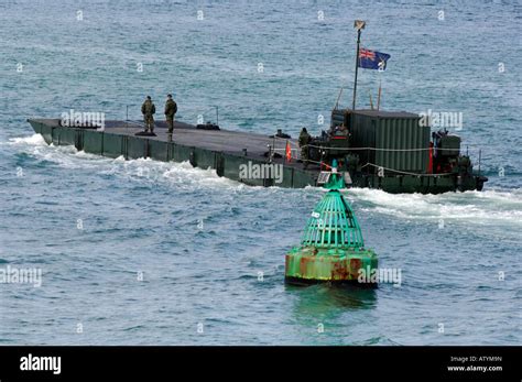 An Army Armed Forces Launch Pontoon Floating Bridge Making Boat From The Maritime Division Of