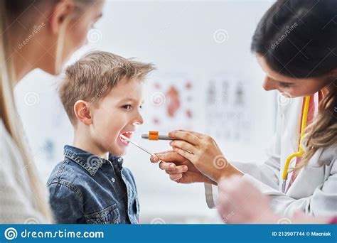 Little Boy Having Medical Examination By Pediatrician Stock Photo
