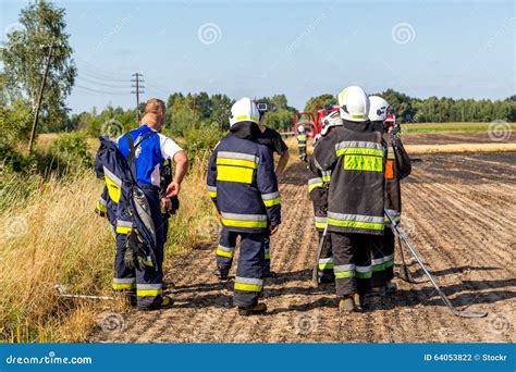 Firefighters Walking On The Field On Fire Editorial Photography Image