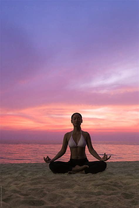 Woman Meditating At Sunset On The Beach By Soren Egeberg Relaxation