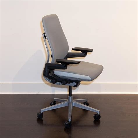 This ergonomic desk chair supports our interactions with today's technologies in the modern office. Lot - A graphite Steelcase Gesture chair.