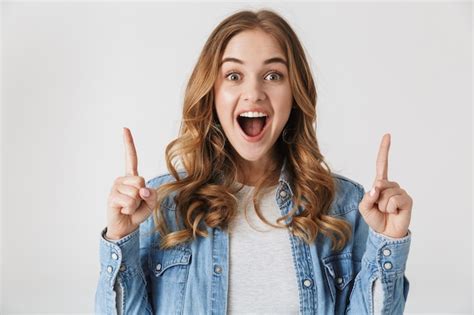 Premium Photo Attractive Excited Young Girl Standing Isolated Over