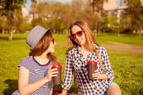 Premium Photo Attractive Happy Women In Glasses Having Picnic And Drinking Coffee