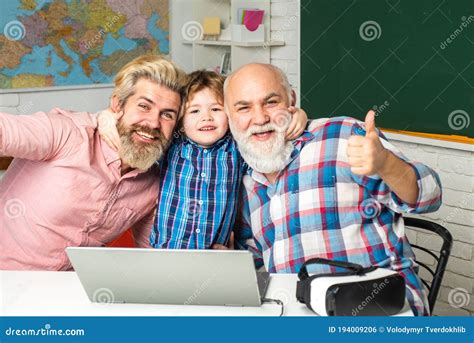 Grandfather Father And Son Computer Games Indoors Pupil With Father