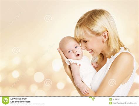 Baby And Mother Newborn Kid With Mom Happy Woman Holding