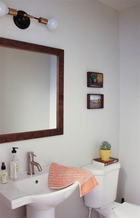 Wood Framed Mirror Sconce Above Mirror Simple Pedestal Sink Via The