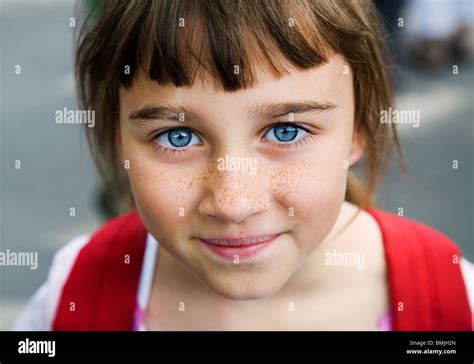 Portrait Of A Girl With Big Blue Eyes And Freckles Sweden Stock Photo