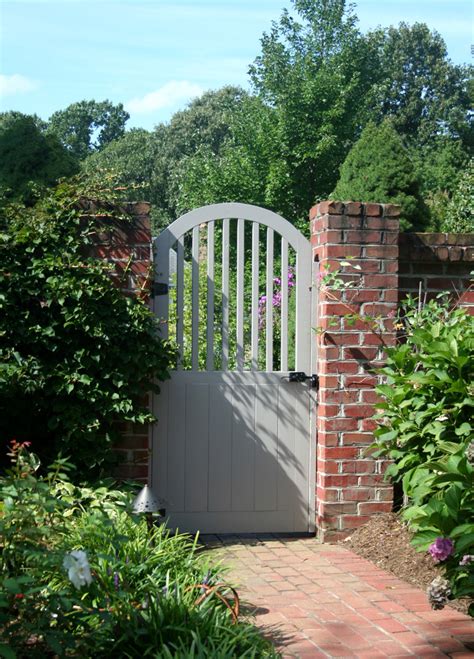 Painted Wood Garden Gate With Brick Wall Traditional Landscape Dc