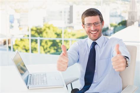 Premium Photo Smiling Businessman Showing Thumbs Up