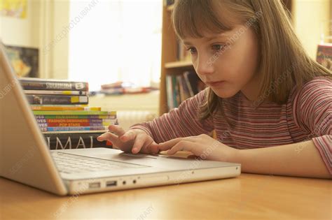 Girl On Computer Stock Image F0033288 Science Photo Library