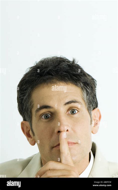 Man Finger Over Mouth Portrait Stock Photo Alamy