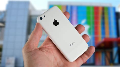 Новый белый Iphone 5c в руке обои для рабочего стола картинки фото