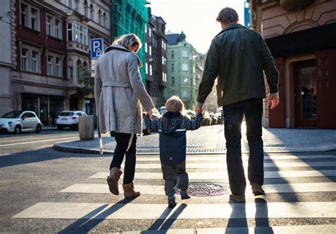 A Toddler Is Crossing The Street Stock Image Image Of Cuddly Cars